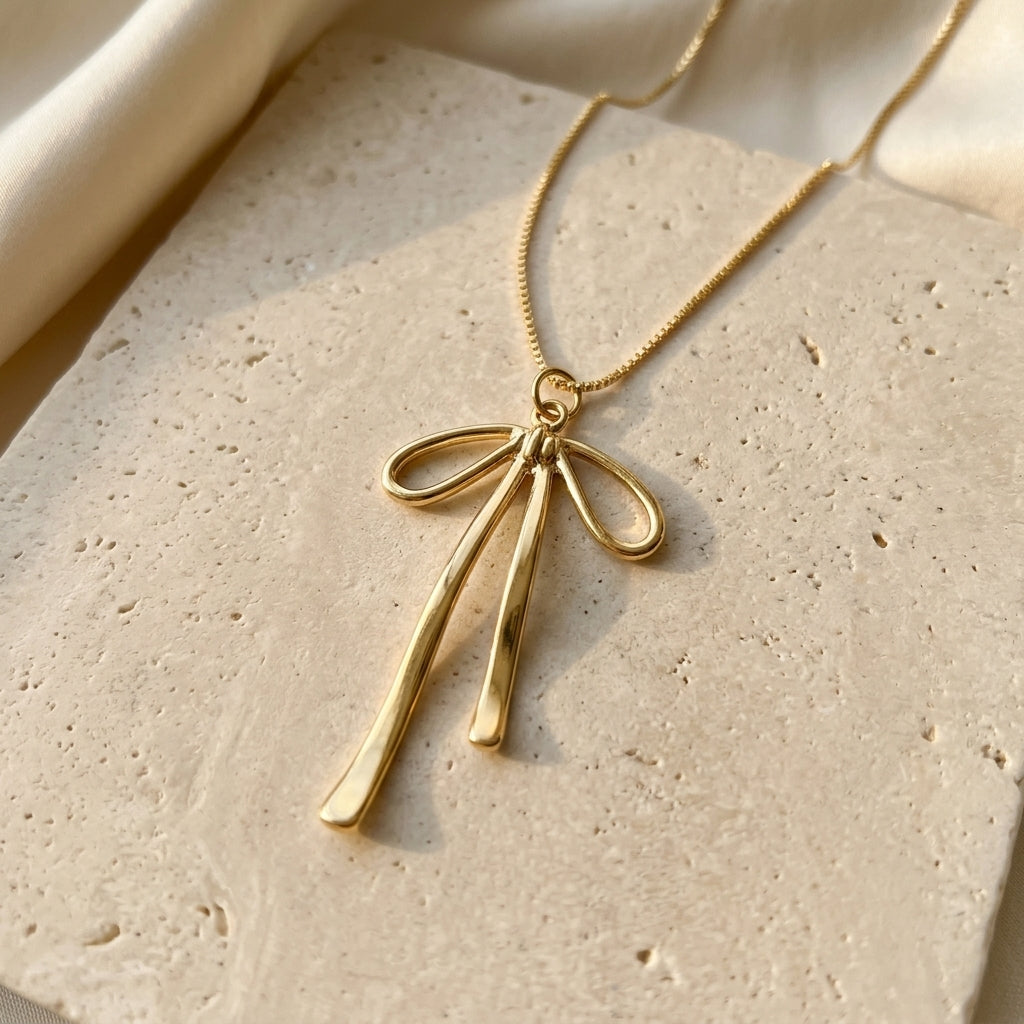 Gold-Tone Ribbon Bow Necklace — product view