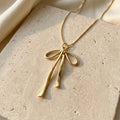 Gold-Tone Ribbon Bow Necklace — product view