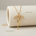 Gold-Tone Ribbon Bow Necklace — detail view