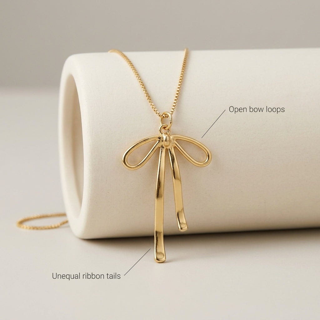 Gold-Tone Ribbon Bow Necklace — detail view