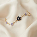 Gold-Tone Midnight Blue Flower Vine Bracelet — detail view
