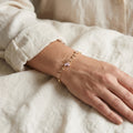 Gold-Tone Pink Butterfly Vine Bracelet — styling view