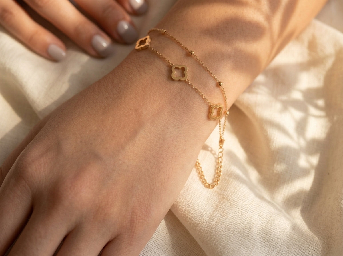 Gold-tone clover bead chain bracelet styled on a wrist